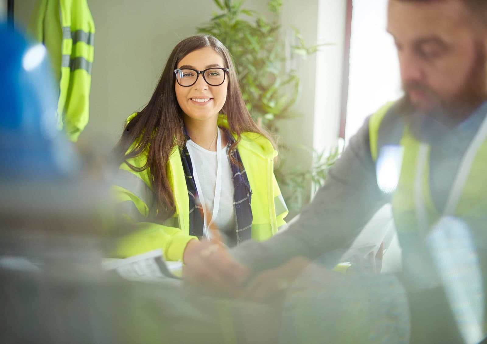 Building department staff reviewing documents in a meeting